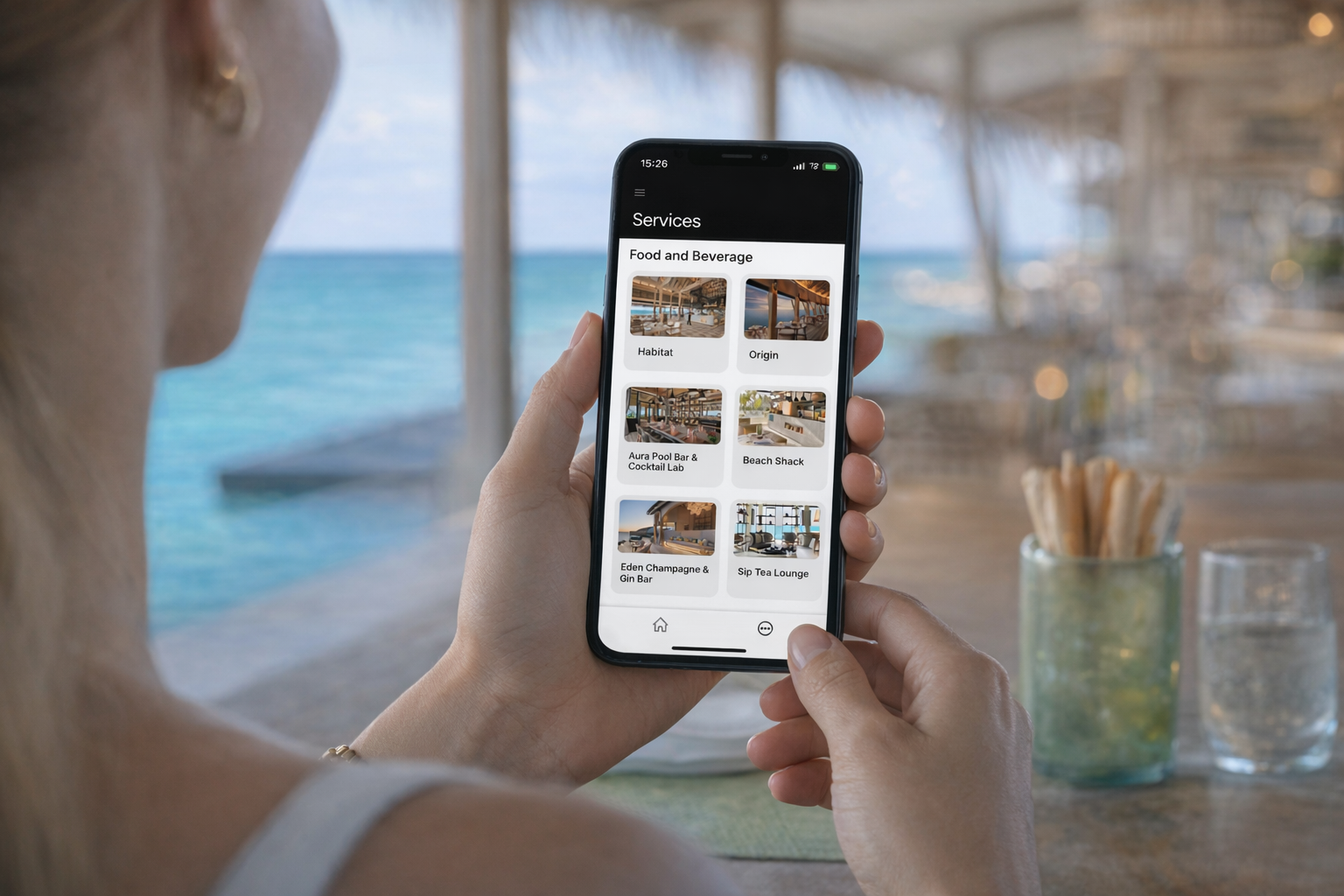 Guest using Hello app on smartphone showing resort services and food & beverage options