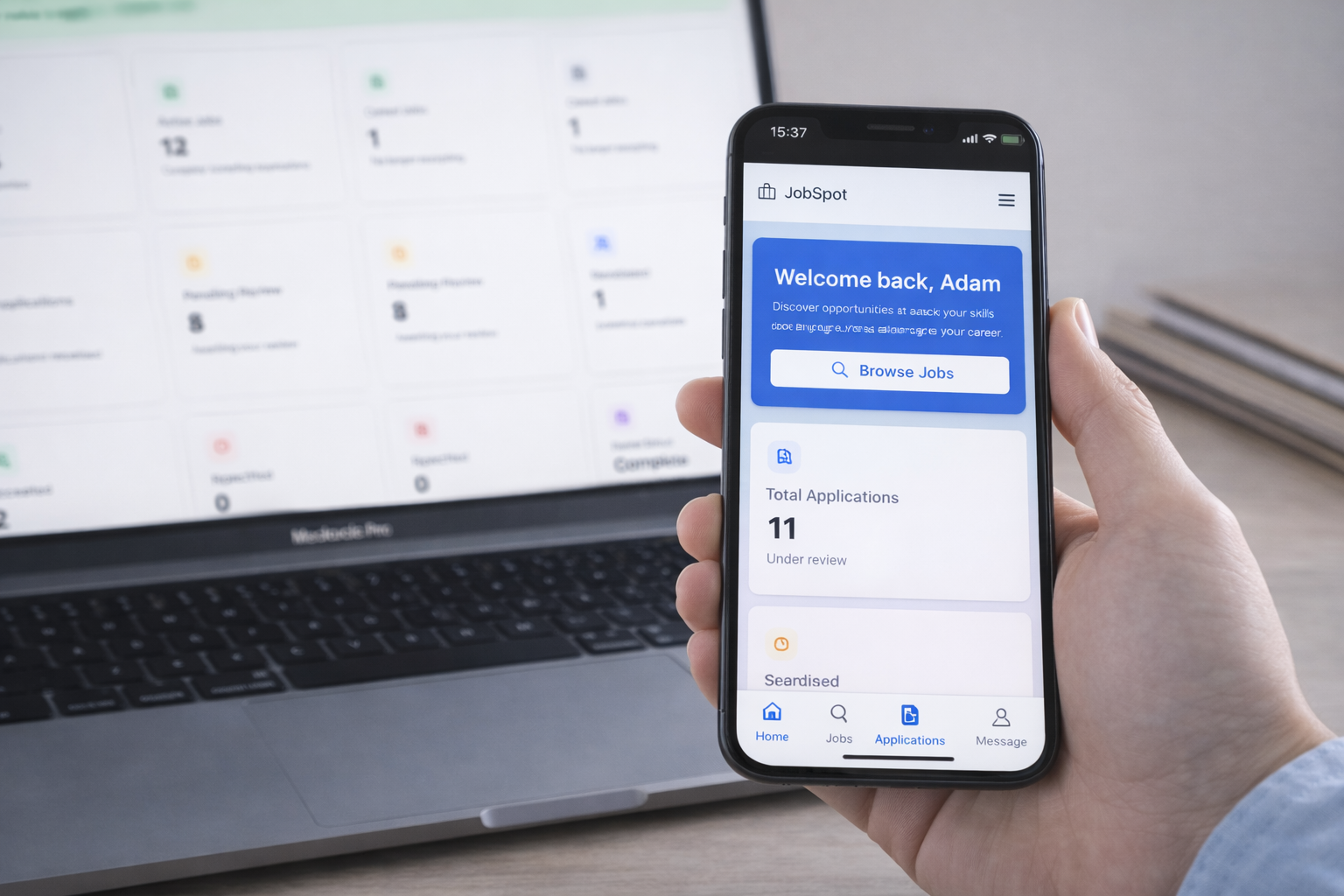 JobSpot employer portal on laptop and job seeker mobile app showing recruitment dashboard and job search features